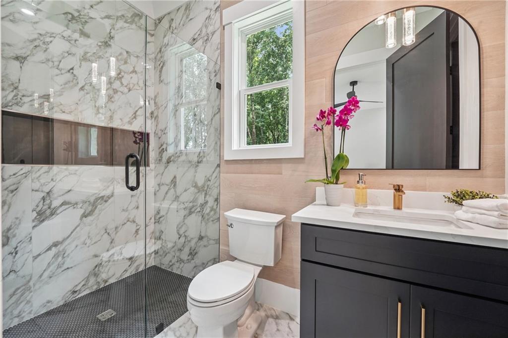 333 Sims Bridge Road Commerce, GA 30530 - Photo 29 of 71 a bathroom with a sink toilet and shower