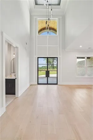 a view of a dining room with furniture and a chandelier