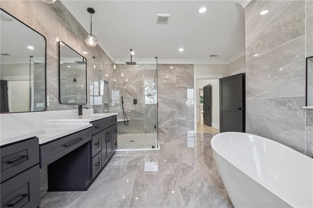 333 Sims Bridge Road Commerce, GA 30530 - Photo 55 of 71 a bathroom with a granite countertop bathtub shower sink and mirror