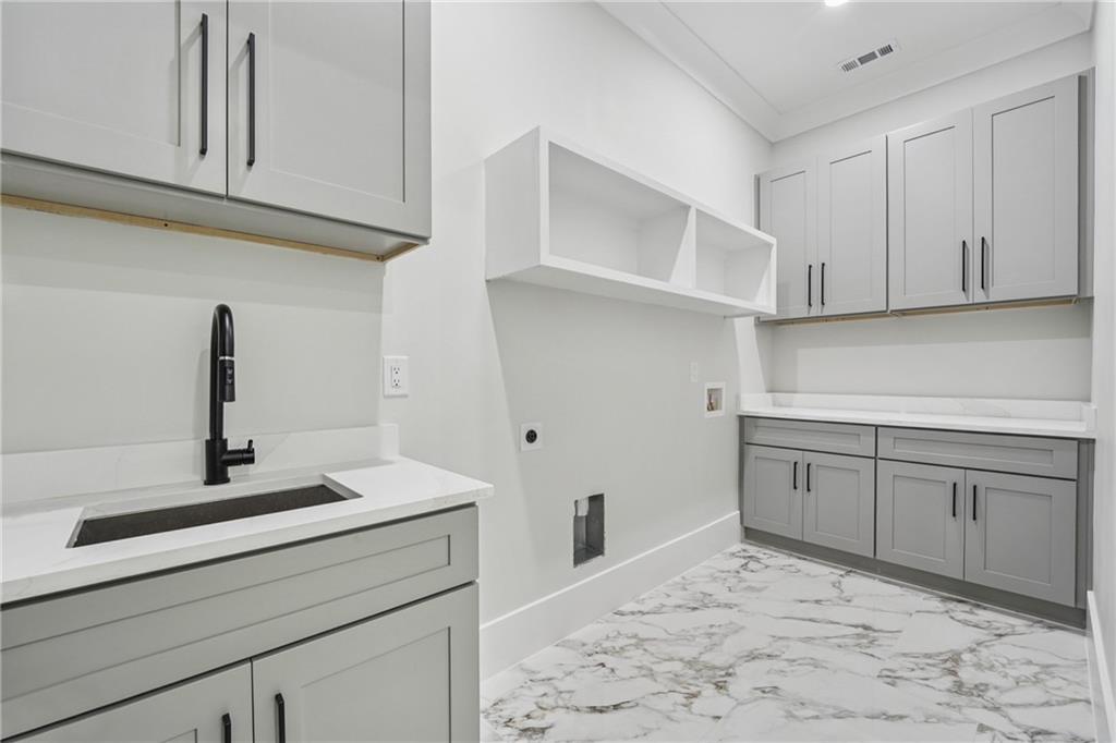 333 Sims Bridge Road Commerce, GA 30530 - Photo 58 of 71 a kitchen with cabinets appliances and a sink