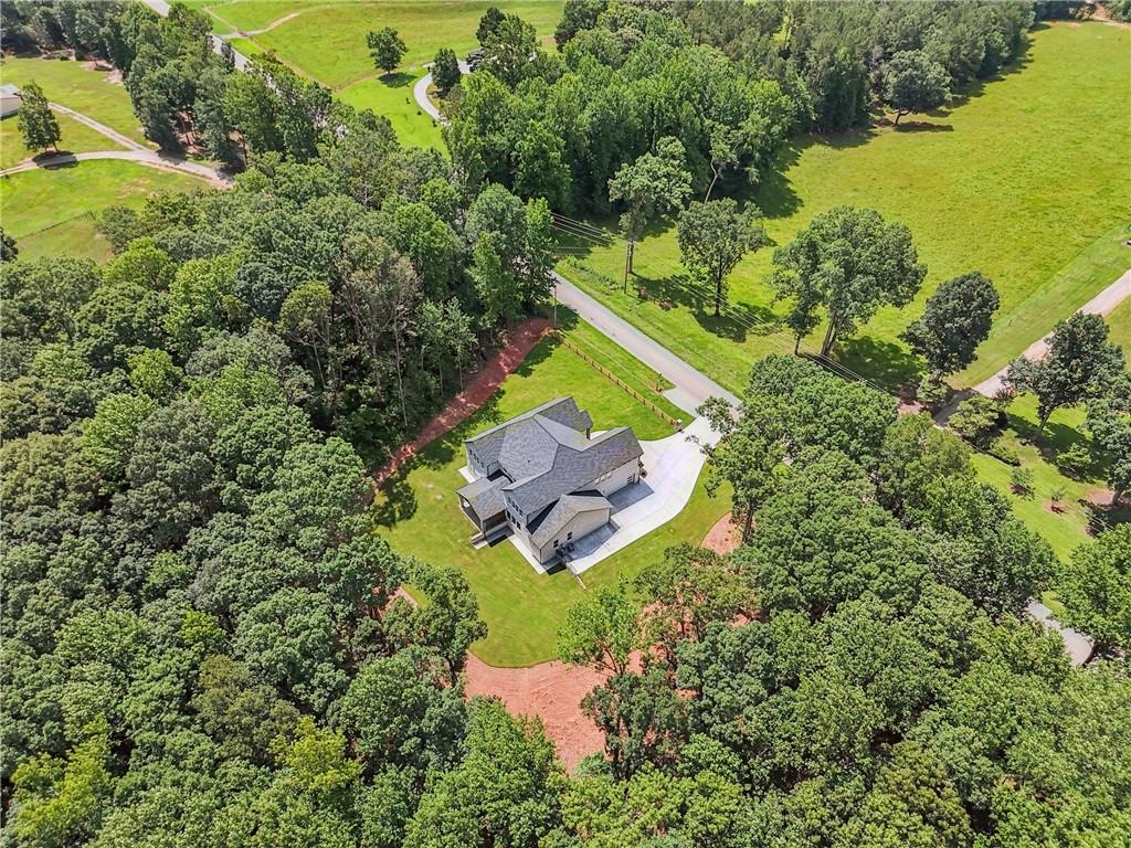 333 Sims Bridge Road Commerce, GA 30530 - Photo 71 of 71 an aerial view of a house with a garden and swimming pool