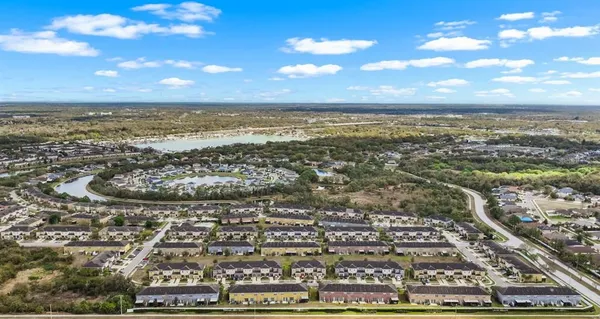 an aerial view of residential building and ocean
