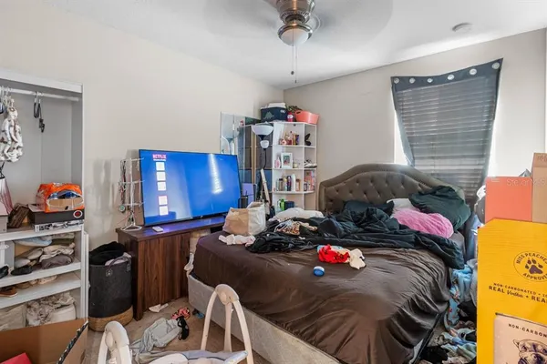 a bedroom with a bed and closet