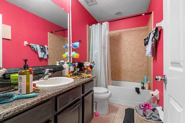 a bathroom with a sink mirror vanity and toilet