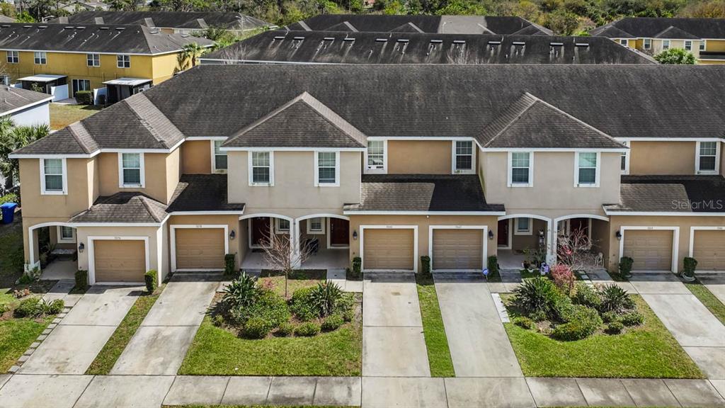 7060 Towne Lake Road Riverview, FL 33578 - Photo 3 of 21 a front view of a house with garden