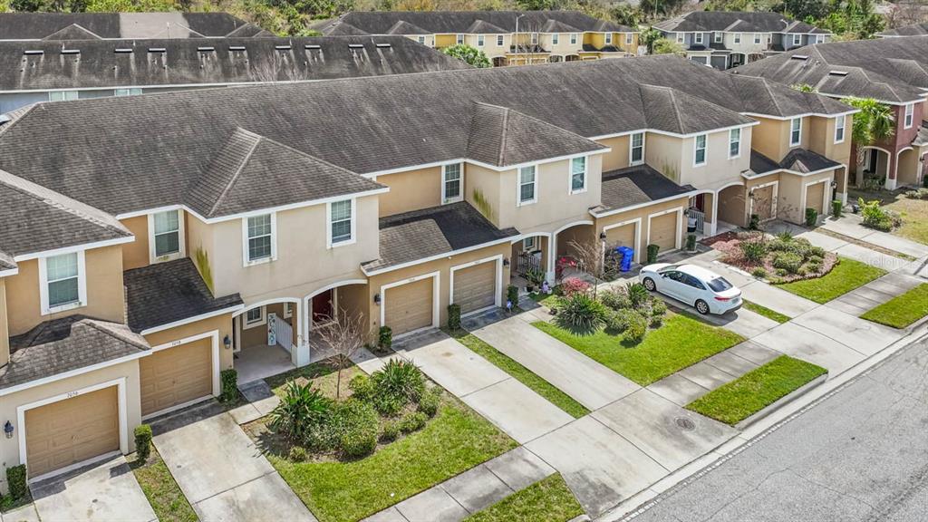 7060 Towne Lake Road Riverview, FL 33578 - Photo 5 of 21 a aerial view of a house with a yard table and chairs