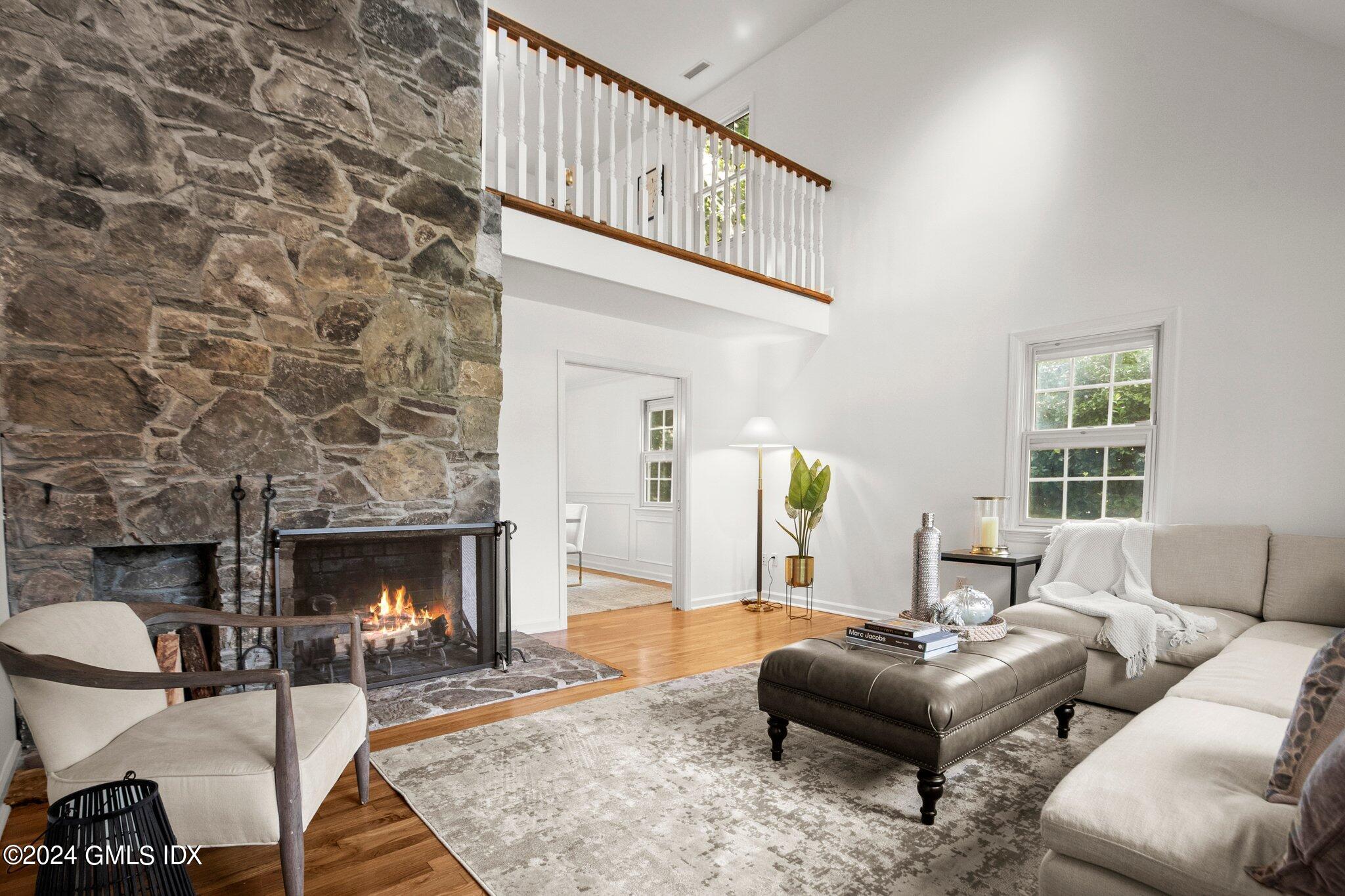 40 Eureka Terrace Stamford, CT 06902 - Photo 15 of 28 a living room with furniture a fireplace and a table