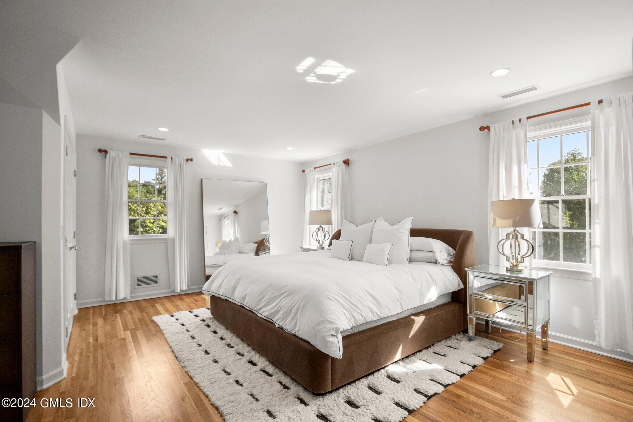 40 Eureka Terrace Stamford, CT 06902 - Photo 21 of 28 a bedroom with a bed and wooden floor