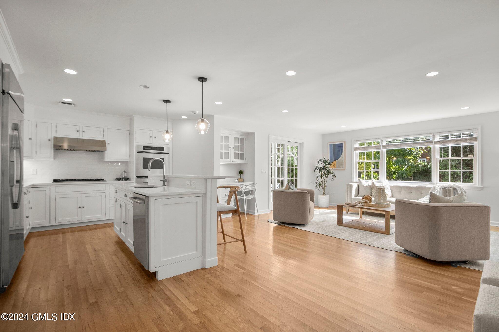 40 Eureka Terrace Stamford, CT 06902 - Photo 5 of 28 a kitchen with white cabinets and stainless steel appliances