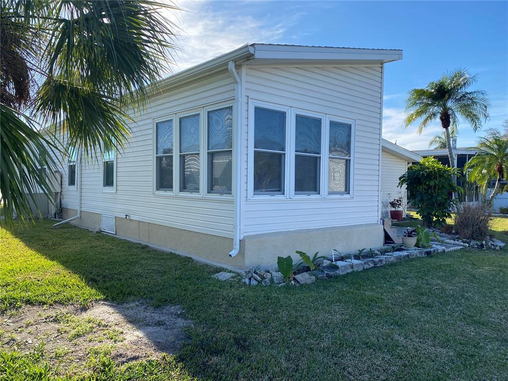 121 Mockingbird Lane Ellenton, FL 34222 - Photo 12 of 24 a front view of a house with a garden