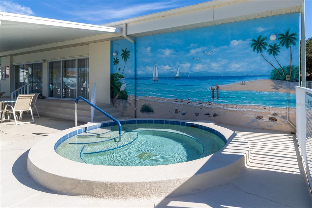 121 Mockingbird Lane Ellenton, FL 34222 - Photo 17 of 24 a view of a swimming pool with a sitting space