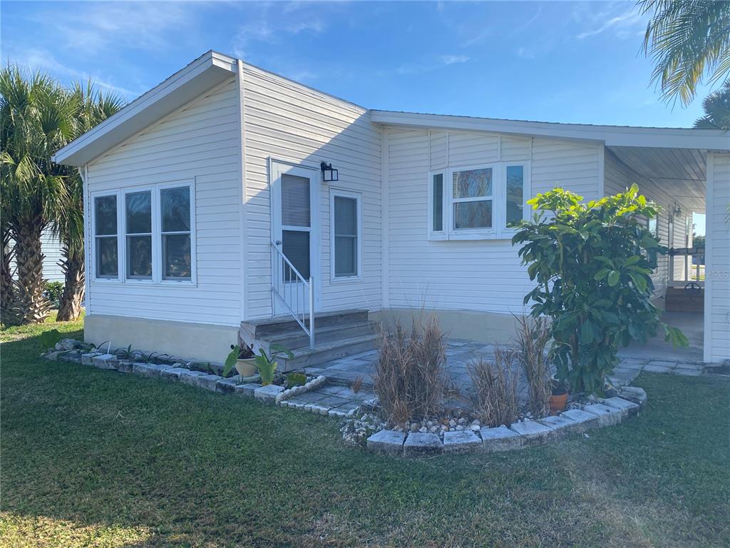 121 Mockingbird Lane Ellenton, FL 34222 - Photo 5 of 24 a front view of a house with garden