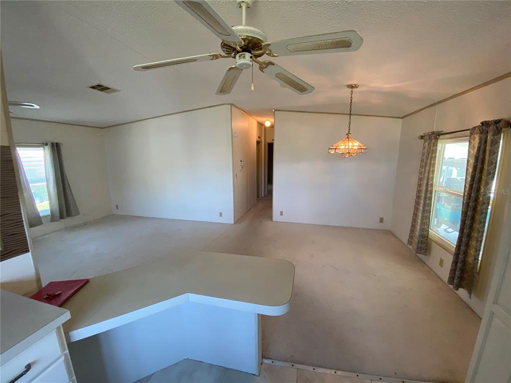121 Mockingbird Lane Ellenton, FL 34222 - Photo 6 of 24 a view of an empty room with a window