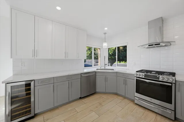 a kitchen with a stove and a sink