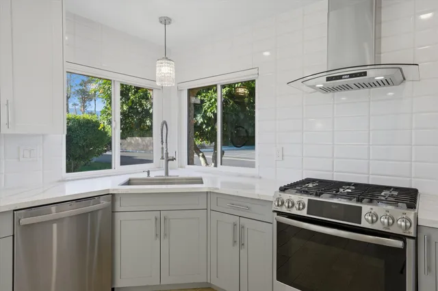 a kitchen with a stove and a sink