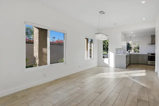 a view of a kitchen with a sink and a window