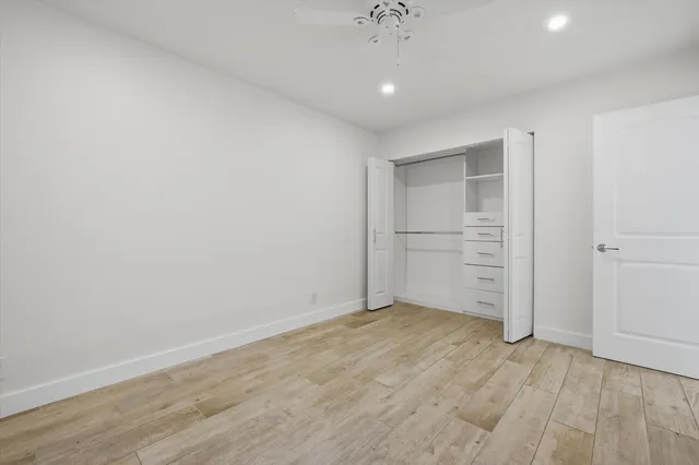 a view of washer and dryer with wooden floor
