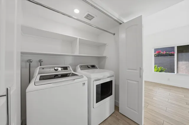 an aerial view of a house with a yard and lake view