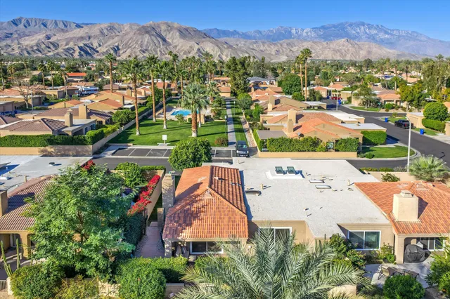a view of a swimming pool with outdoor seating