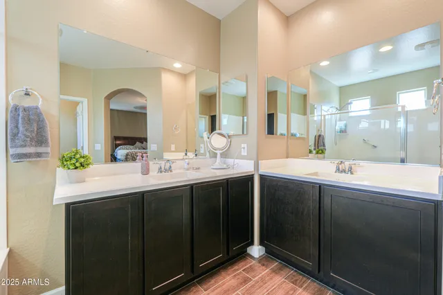 a bathroom with a shower and a glass door