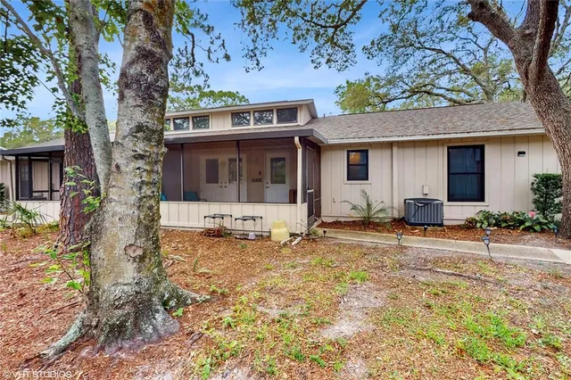 a house with trees in the background