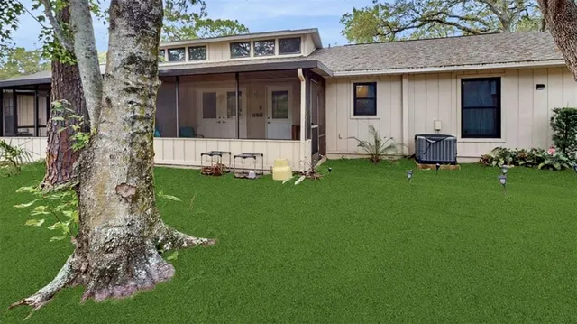 a front view of a house with a garden and yard