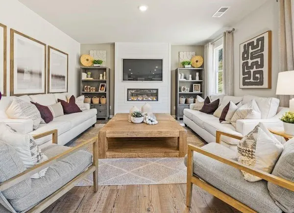a living room with furniture and a flat screen tv