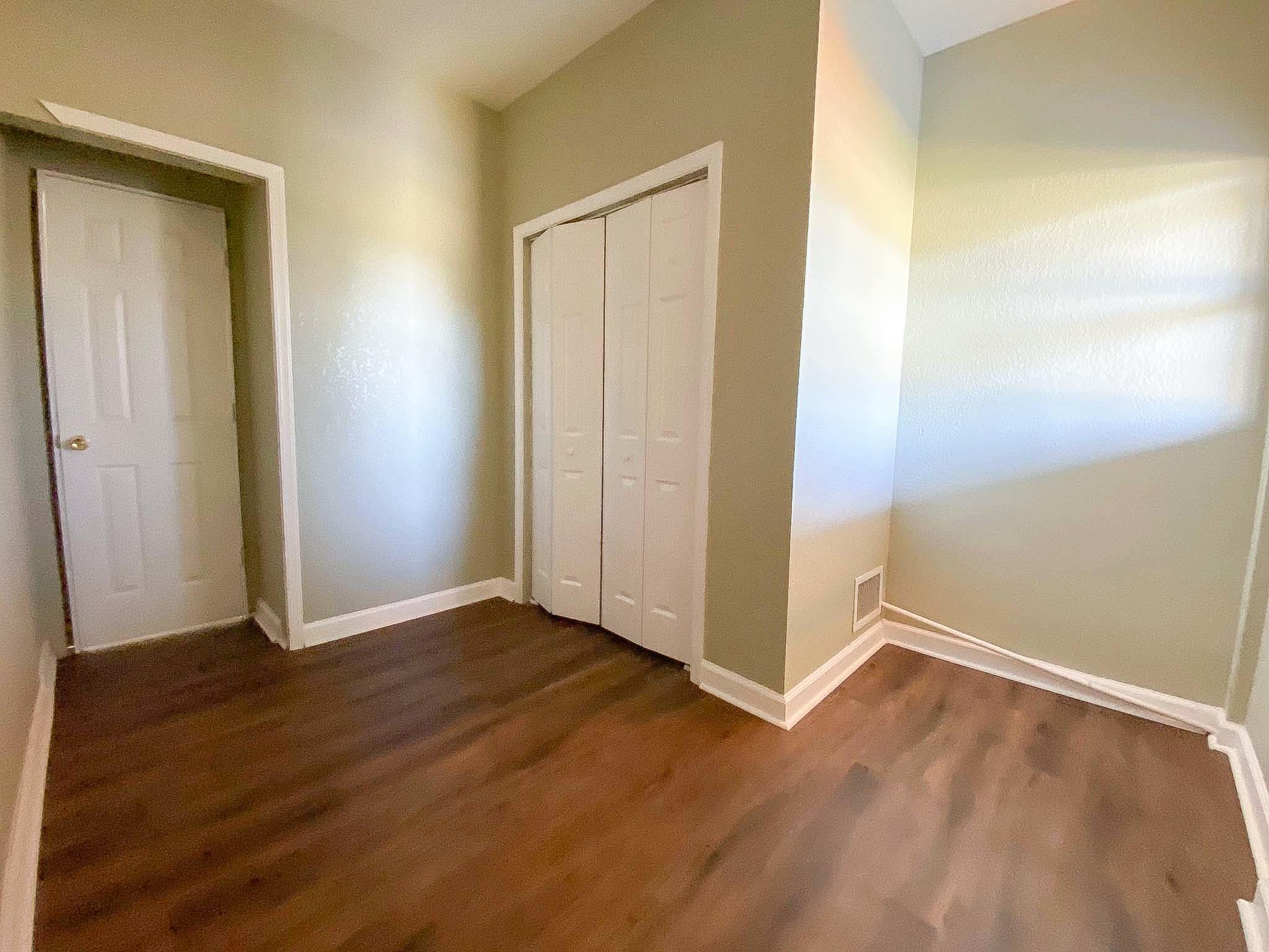 3715 Flying Cow Ranch Road Wellington, FL 33470 - Photo 30 of 33 an empty room with wooden floor and closet
