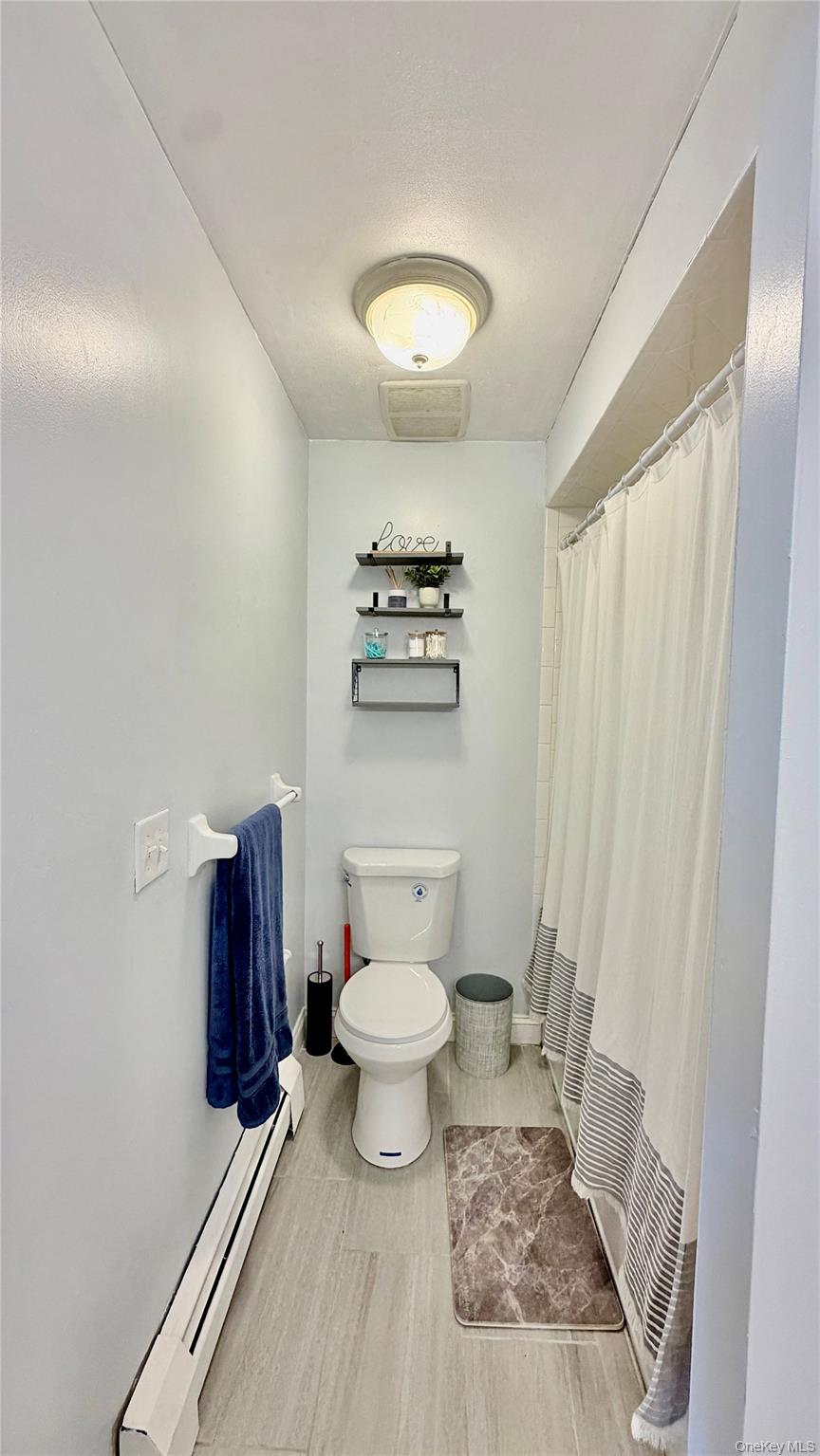 25 Pierces Road, Unit 28 Newburgh, NY 12550 - Photo 15 of 21 a bathroom with a toilet a sink and a mirror