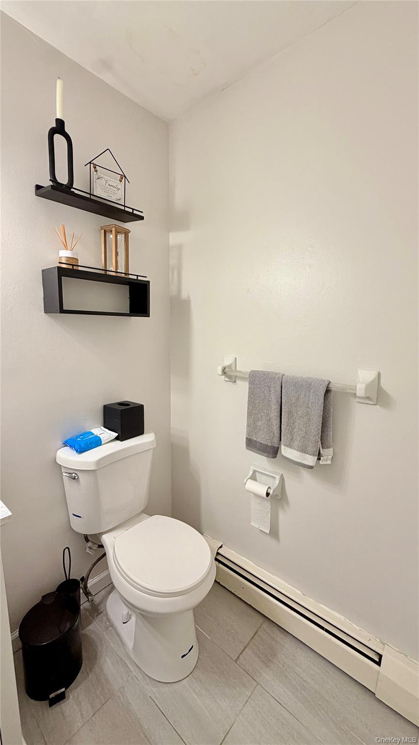 25 Pierces Road, Unit 28 Newburgh, NY 12550 - Photo 16 of 21 a white toilet sitting next to a bathroom sink