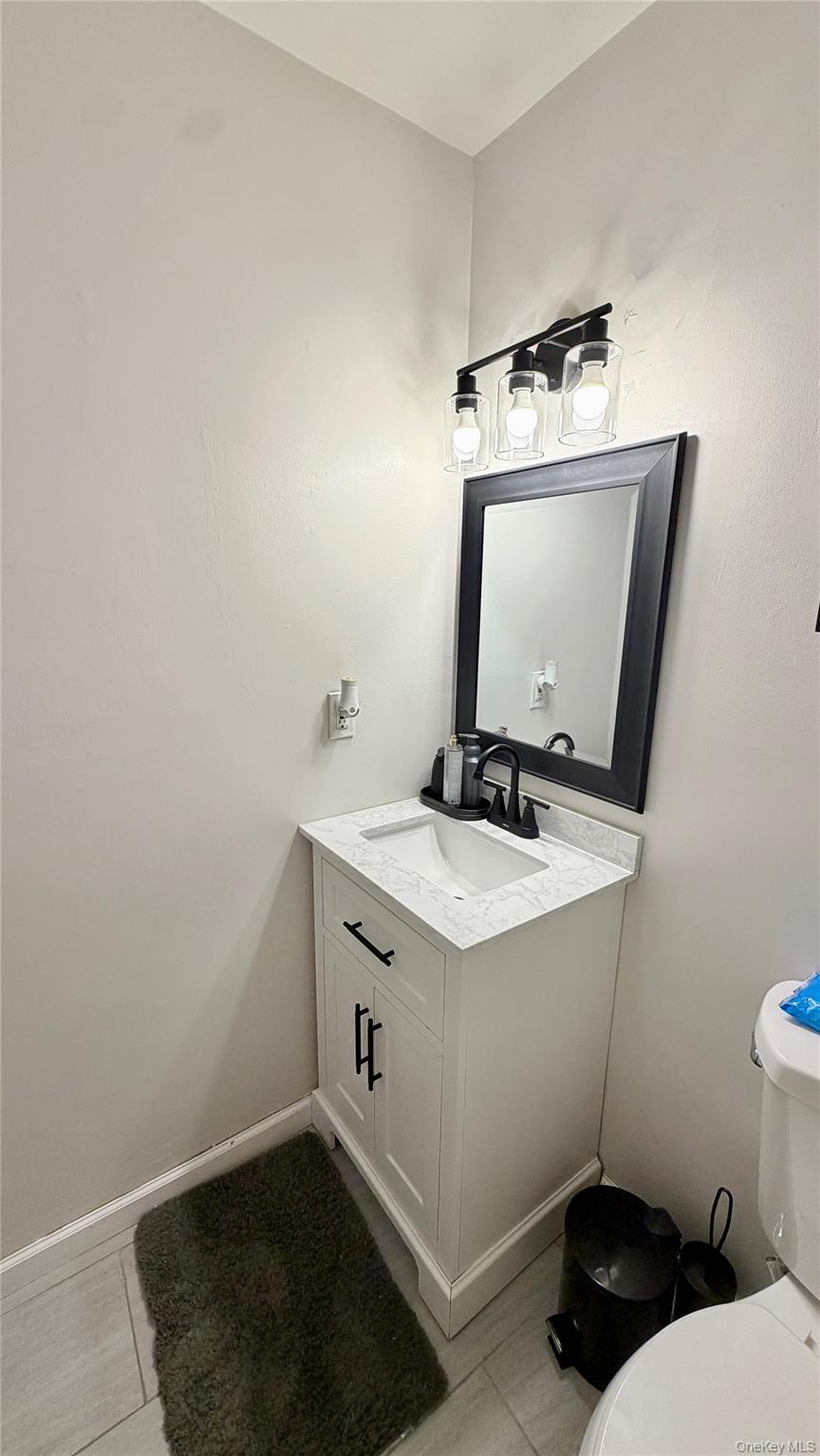 25 Pierces Road, Unit 28 Newburgh, NY 12550 - Photo 17 of 21 a bathroom with a sink a toilet and vanity