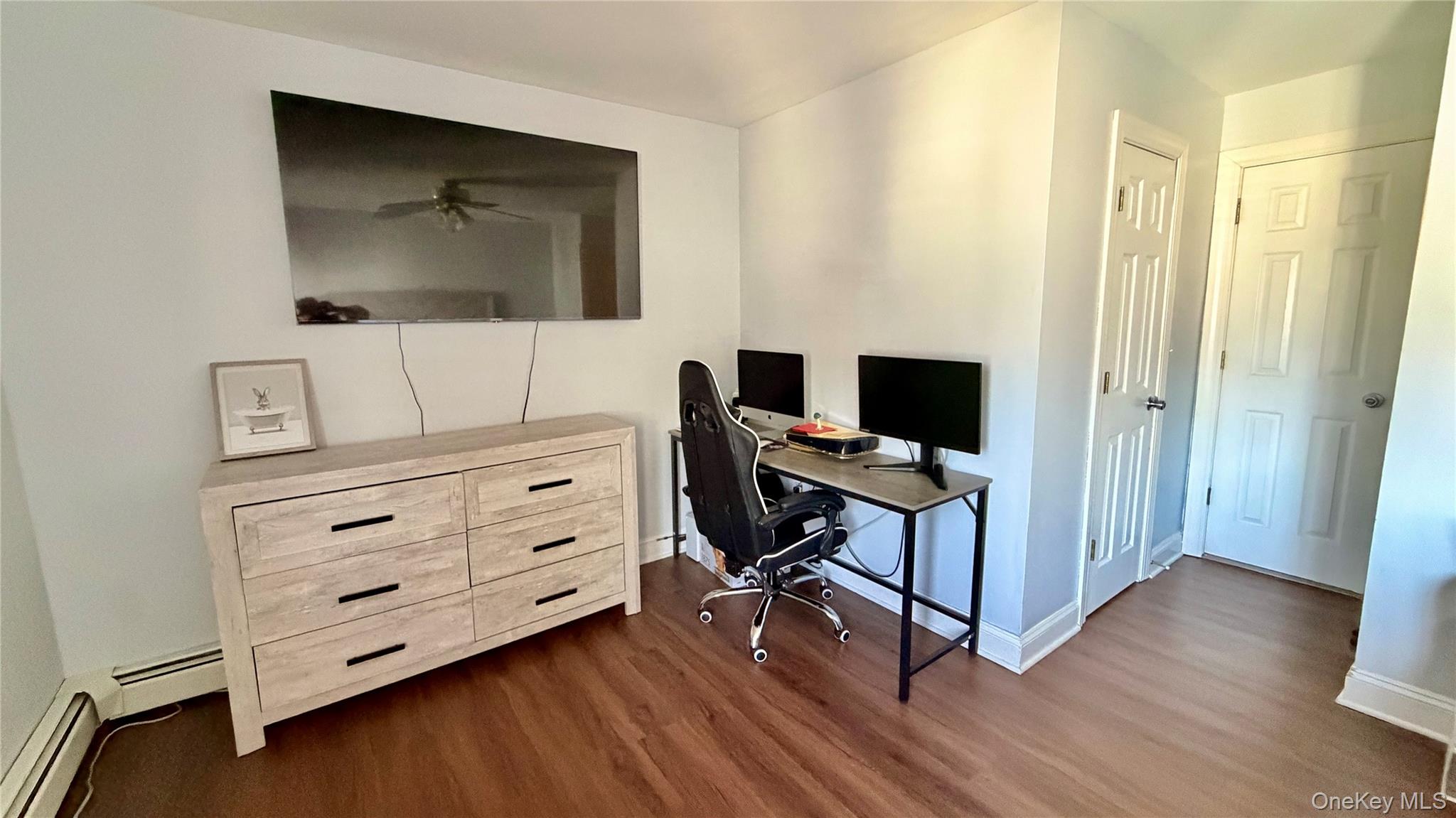 25 Pierces Road, Unit 28 Newburgh, NY 12550 - Photo 9 of 21 a room with chair and flat screen tv