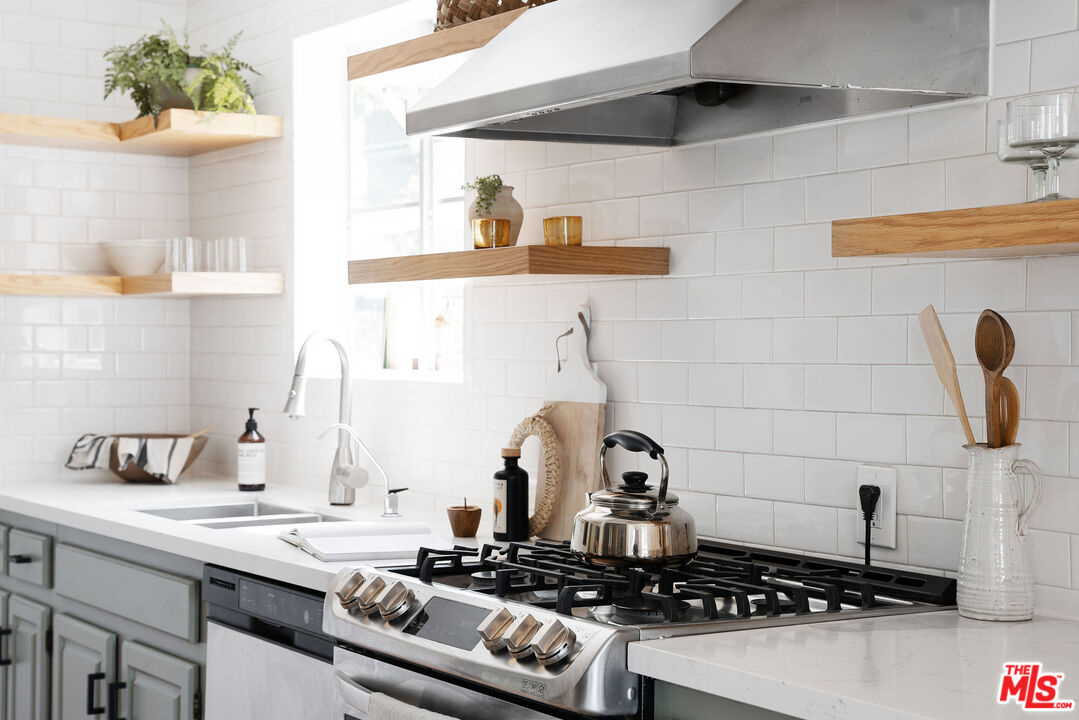 230 Marathon Road Altadena, CA 91001 - Photo 11 of 46 a kitchen with a stove and cabinets