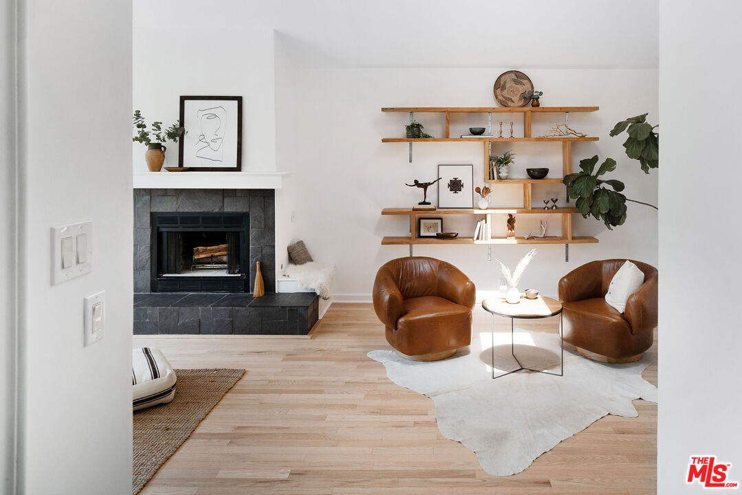 230 Marathon Road Altadena, CA 91001 - Photo 16 of 46 a living room with furniture and a fireplace