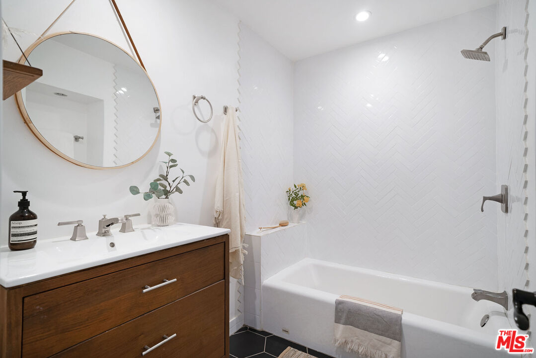 230 Marathon Road Altadena, CA 91001 - Photo 24 of 46 a bathroom with a tub sink and mirror