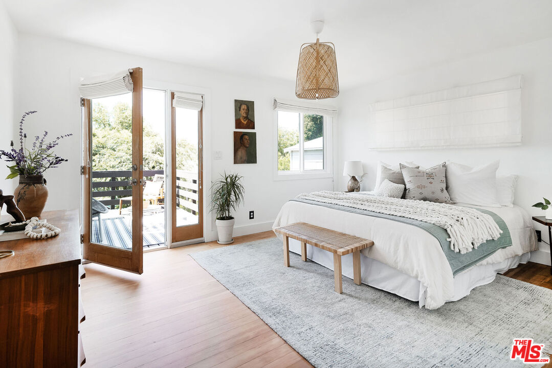 230 Marathon Road Altadena, CA 91001 - Photo 25 of 46 a bedroom with furniture and a large window