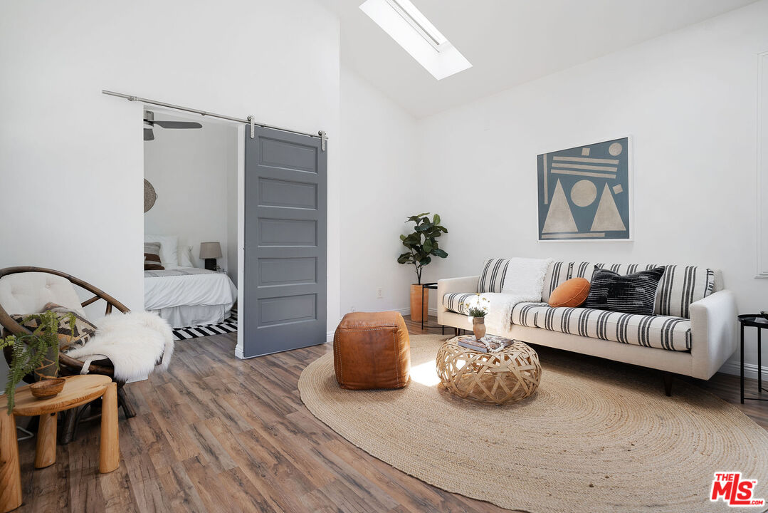 230 Marathon Road Altadena, CA 91001 - Photo 37 of 46 a bedroom with furniture and a wooden floor