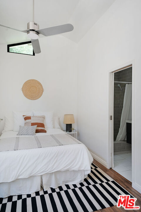 230 Marathon Road Altadena, CA 91001 - Photo 39 of 46 a bedroom with a bed and a lamp on the dresser