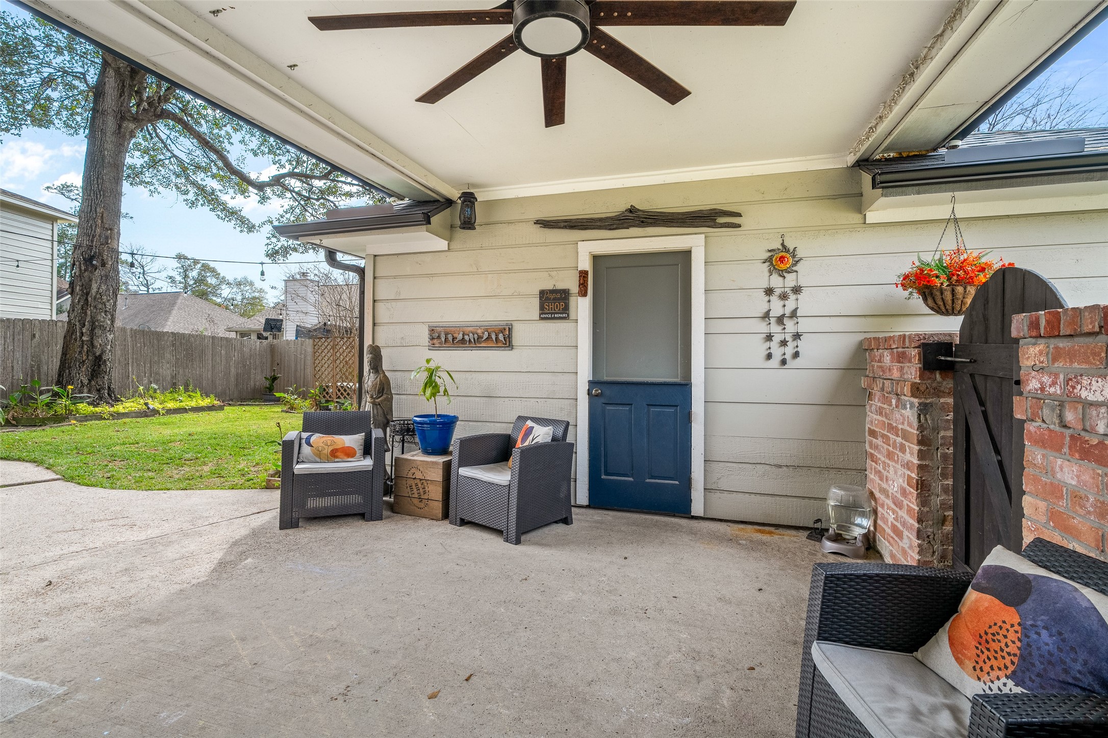 41 Windsor Drive Conroe, TX 77304 - Photo 33 of 39 Covered backyard patio featuring a ceiling fan, concrete flooring, and space for outdoor seating. Provides a shaded area for relaxing or entertaining with convenient access to the backyard.