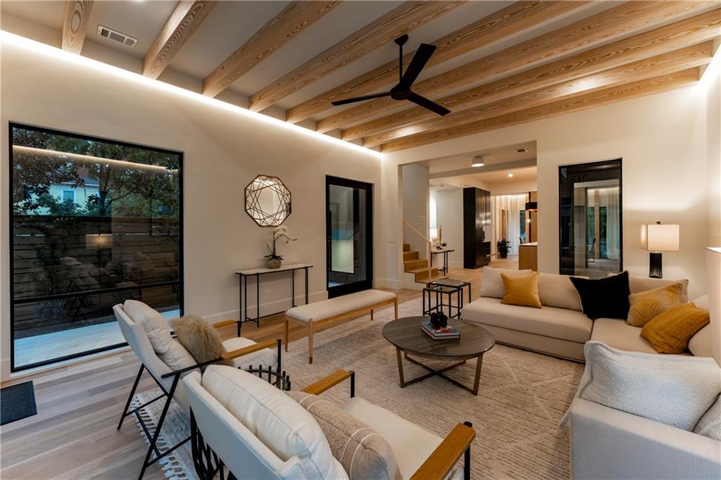 787 Bonaventure Avenue Northeast Atlanta, GA 30306 - Photo 16 of 64 a living room with furniture a ceiling fan and a large window