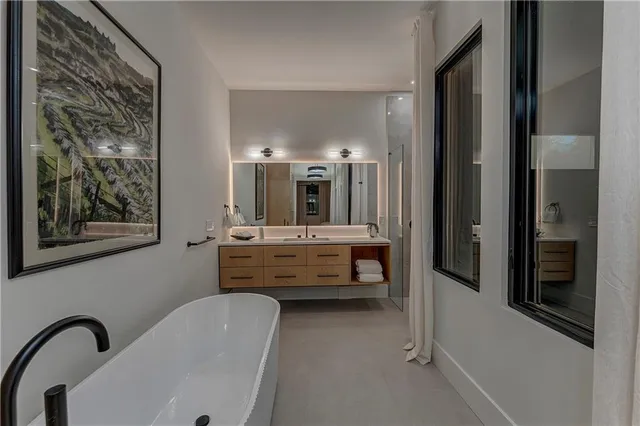 a bathroom with a sink and mirror