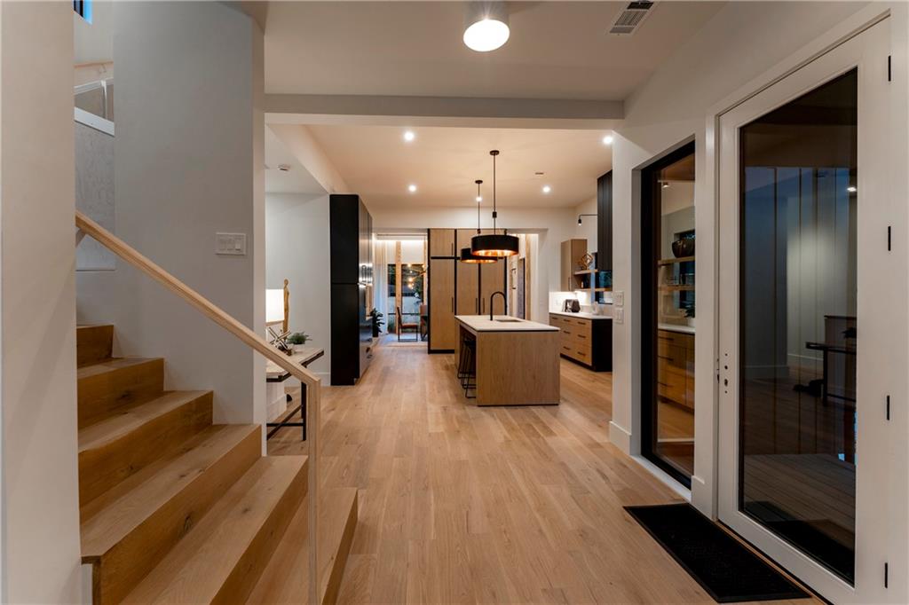 787 Bonaventure Avenue Northeast Atlanta, GA 30306 - Photo 24 of 64 a view of a hallway with wooden floor and furniture