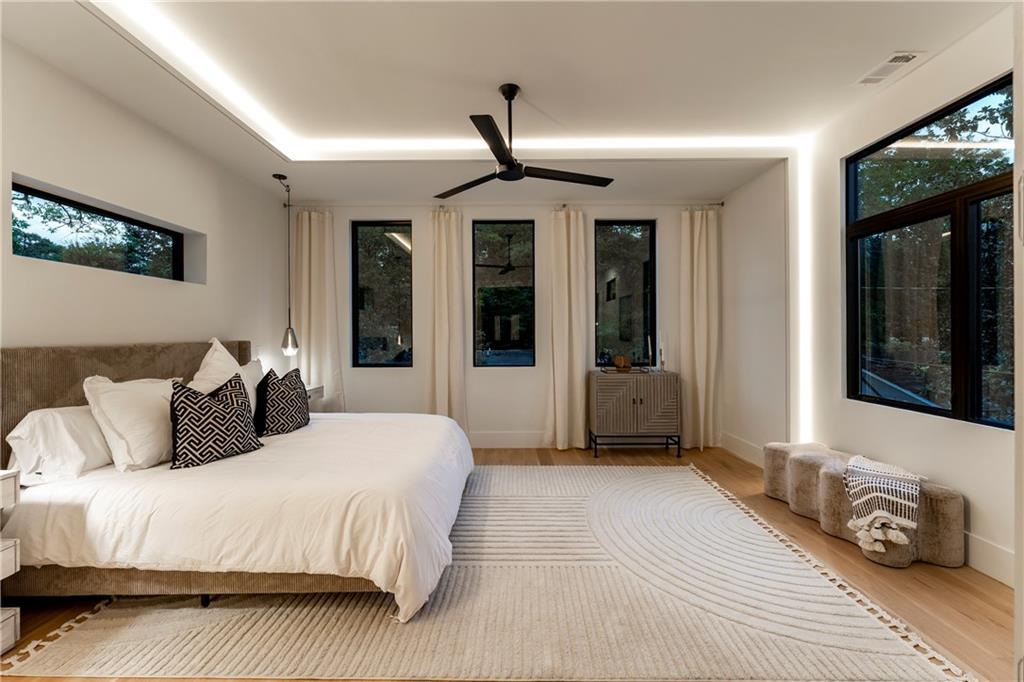 787 Bonaventure Avenue Northeast Atlanta, GA 30306 - Photo 30 of 64 a bedroom with a large bed and windows