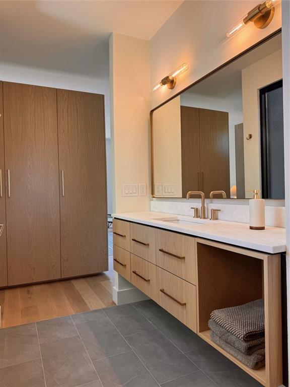 787 Bonaventure Avenue Northeast Atlanta, GA 30306 - Photo 34 of 64 a bathroom with a double vanity sink and a mirror