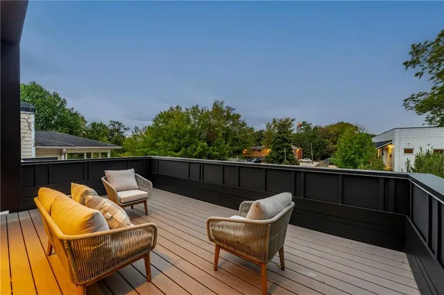 a bathroom with a toilet sink vanity and mirror