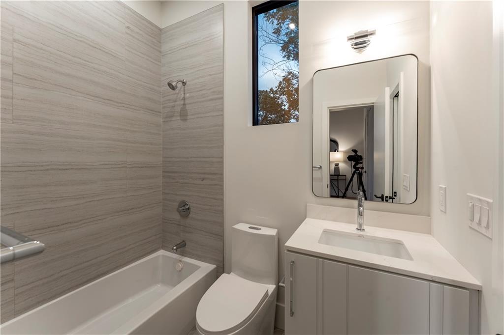 787 Bonaventure Avenue Northeast Atlanta, GA 30306 - Photo 40 of 64 a bathroom with a sink a toilet and shower