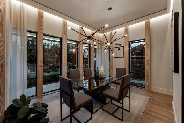 a view of a dining room with furniture window and wooden floor