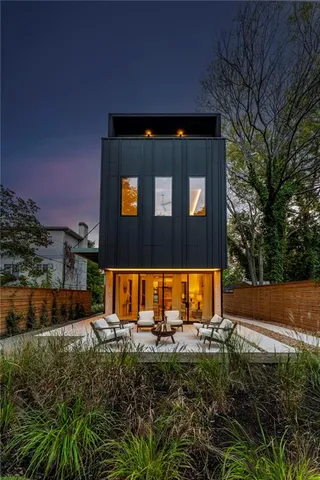 a view of a house with a backyard