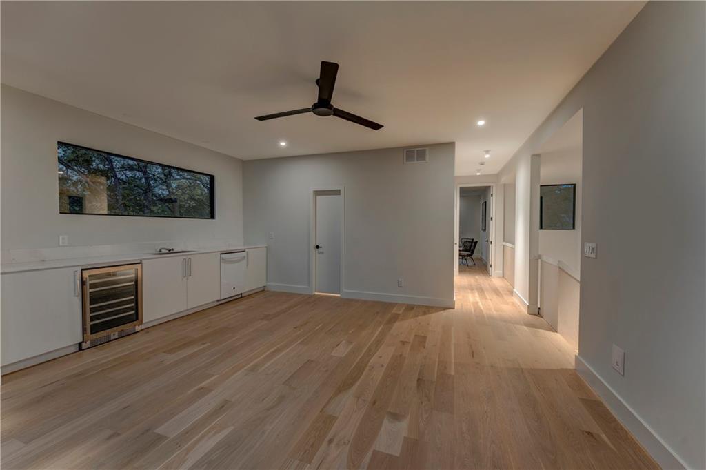 787 Bonaventure Avenue Northeast Atlanta, GA 30306 - Photo 45 of 64 a view of a livingroom with wooden floor and a ceiling fan