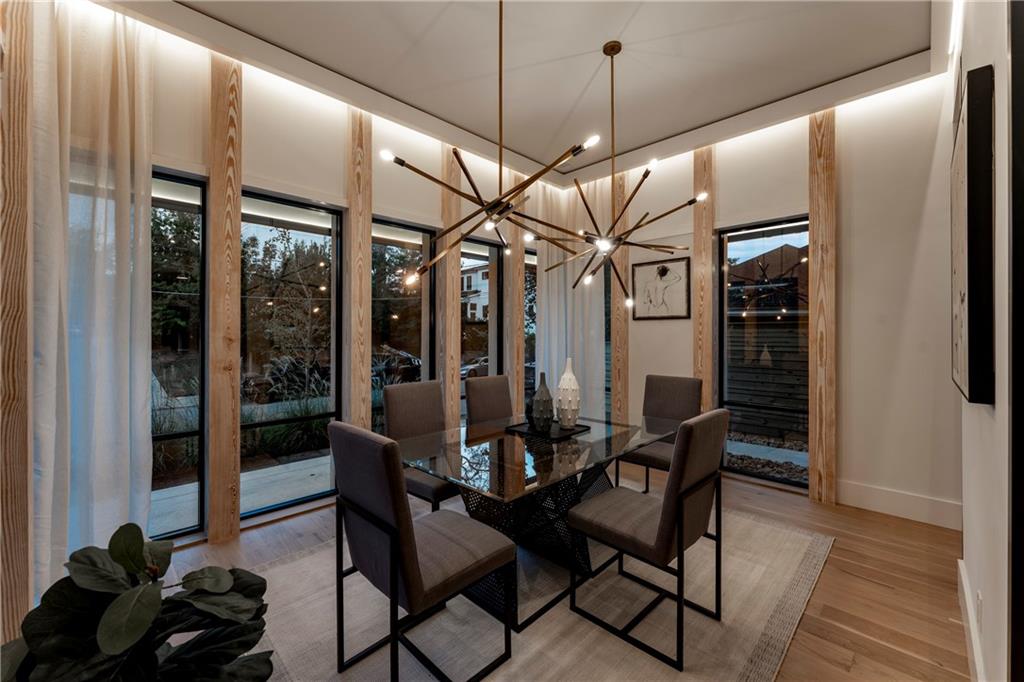787 Bonaventure Avenue Northeast Atlanta, GA 30306 - Photo 8 of 64 a view of a dining room with furniture window and wooden floor